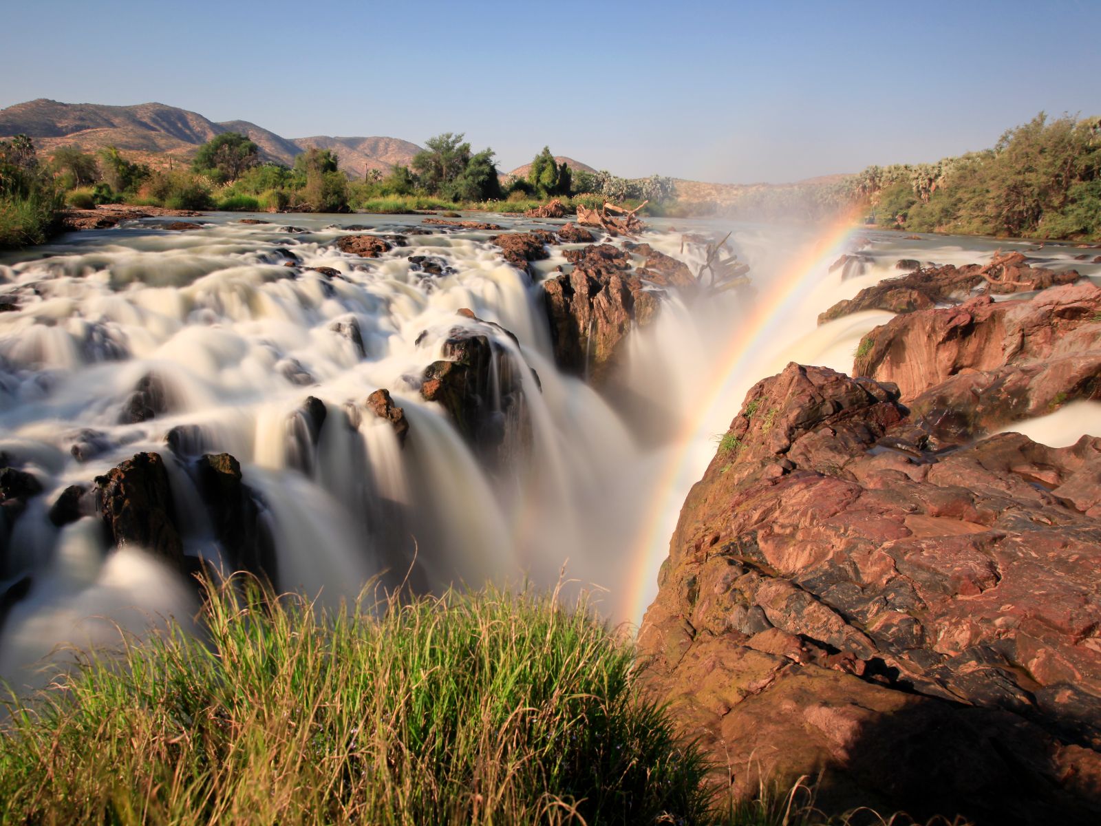 Rondreis Namibië, Epupa Falls, waterval met regenboog
