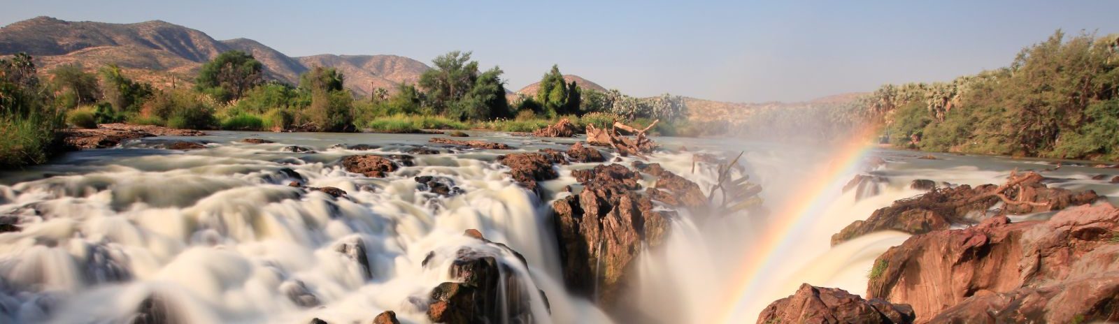 Rondreis Namibie Epupa Falls waterval uitzicht met regenboog